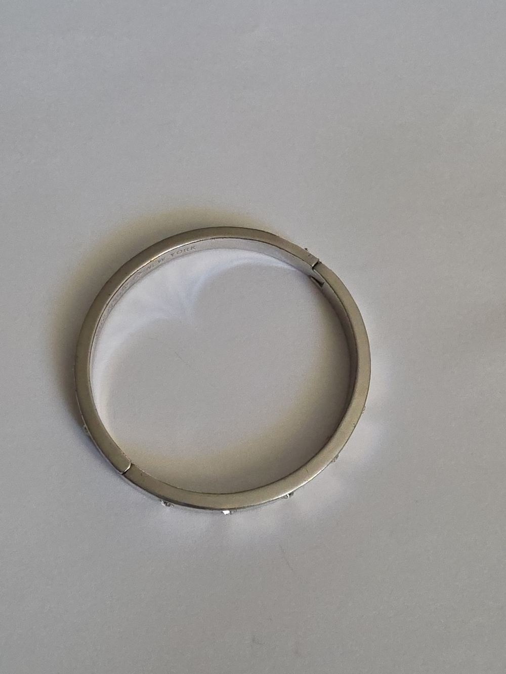 kate spade Silver Tone Logo Engraved Bangle Bracelet
